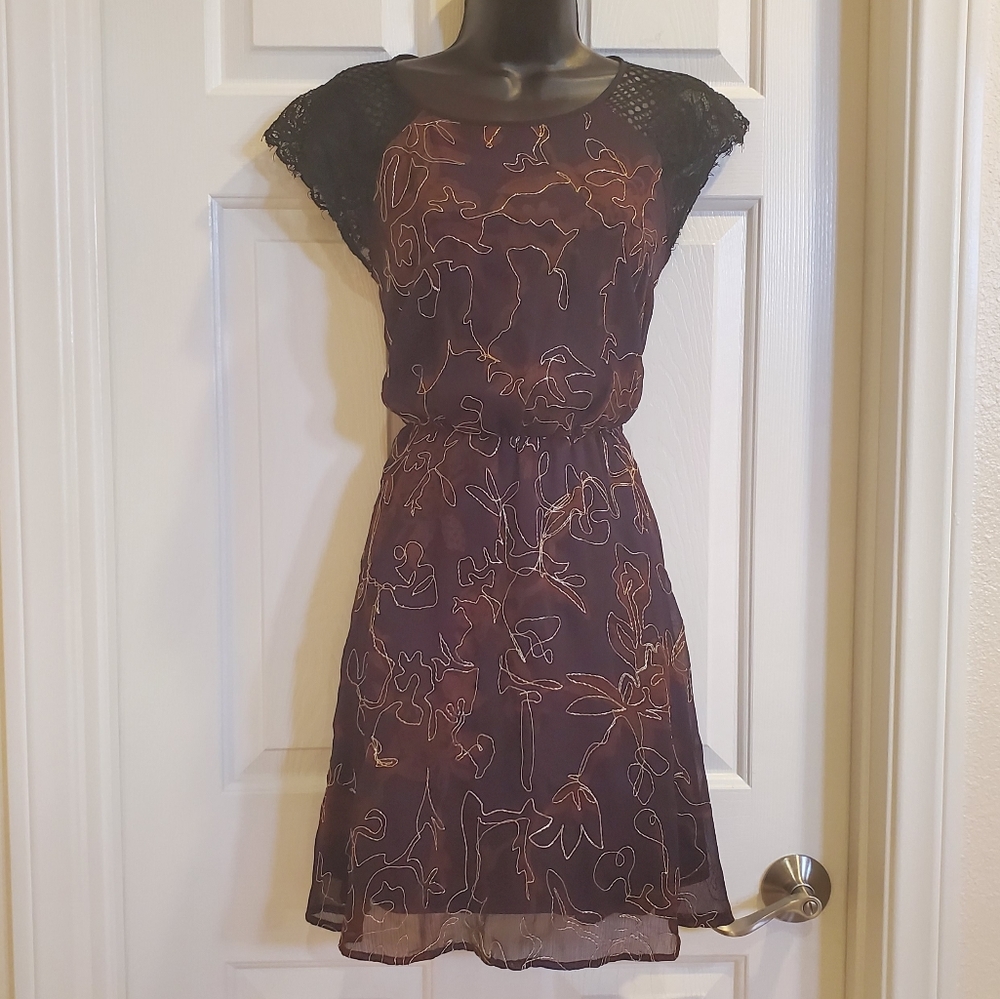 Dress with lace and gold embellishments